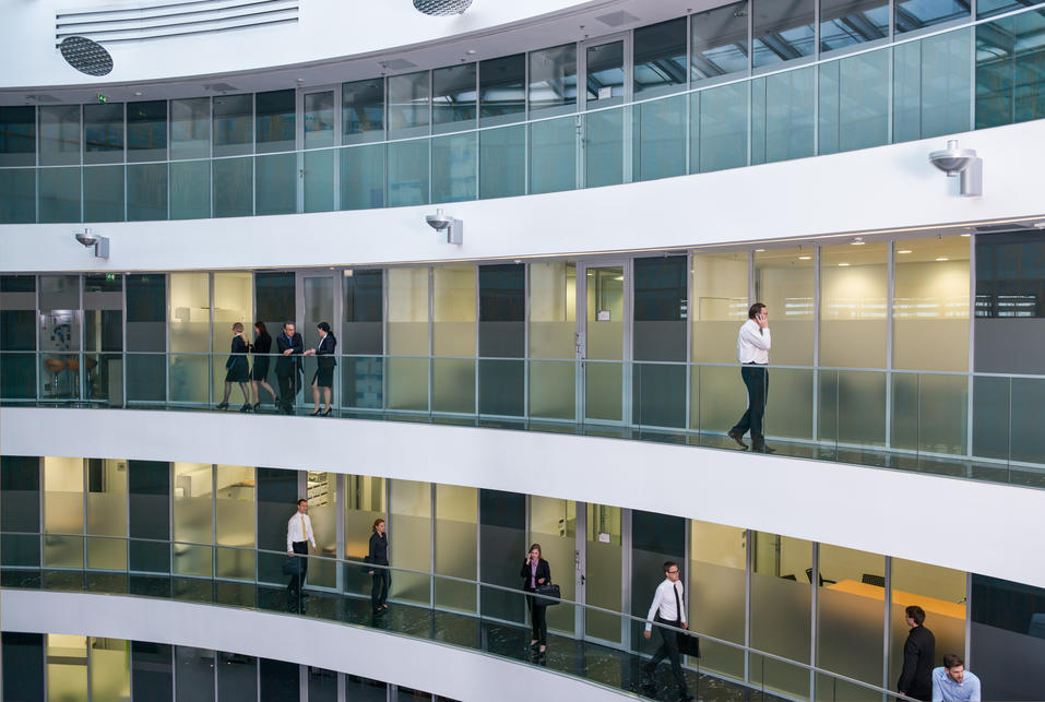 People on stairs of modern building